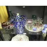 A collection of glass: to include: a Caithness paperweight, blue and ruby overlay vases, drinking