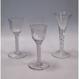 Three 18th century wine glasses, two with etched bowls