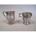 A Victorian and an Art Deco silver christening mug (2)