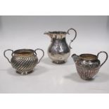 Two silver jugs and a two handled sugar