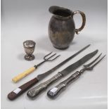 A George III silver pepper, a Dutch silver handled carving knife and fork, a bread fork, another