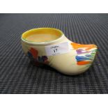 A Clarice Cliff Crocus pattern clog Firinjg crack to interior. Discolouration to one side.