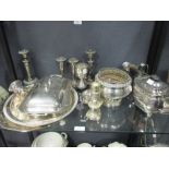 A quantity of electroplate, to include: a three piece tea set, waiters, candlesticks etc