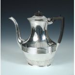 An Edwardian silver coffee pot, by John Bodman Carrington, London 1901, of oval baluster shape,