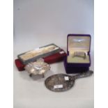 A silver butter shell, four cased knapkin rings, pearl necklace, watch and a silver backed hand
