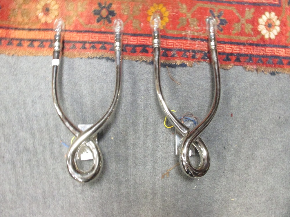 A pair of chrome wall lights