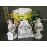 A pair of Derby putti, a porcelain figure group, a silvered glass vase and a Worcester vase
