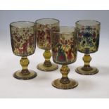 Five Bohemian decorated green glass goblets