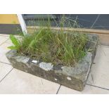 A reconstituted stone garden trough, 15 x 48 x 64cm