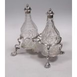 A George II silver cruet frame with two bottles (damaged)