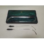 A leather cased set of silver plated catheters by Arnold