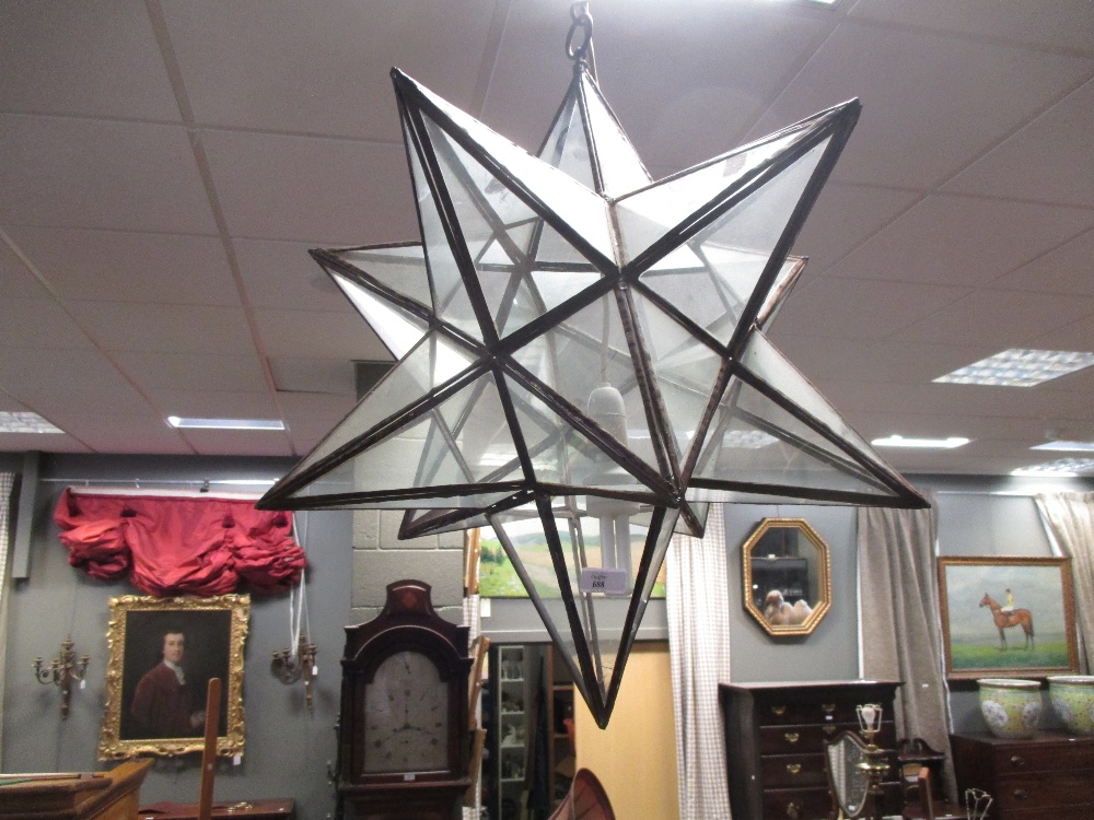 A star shaped hanging ceiling light