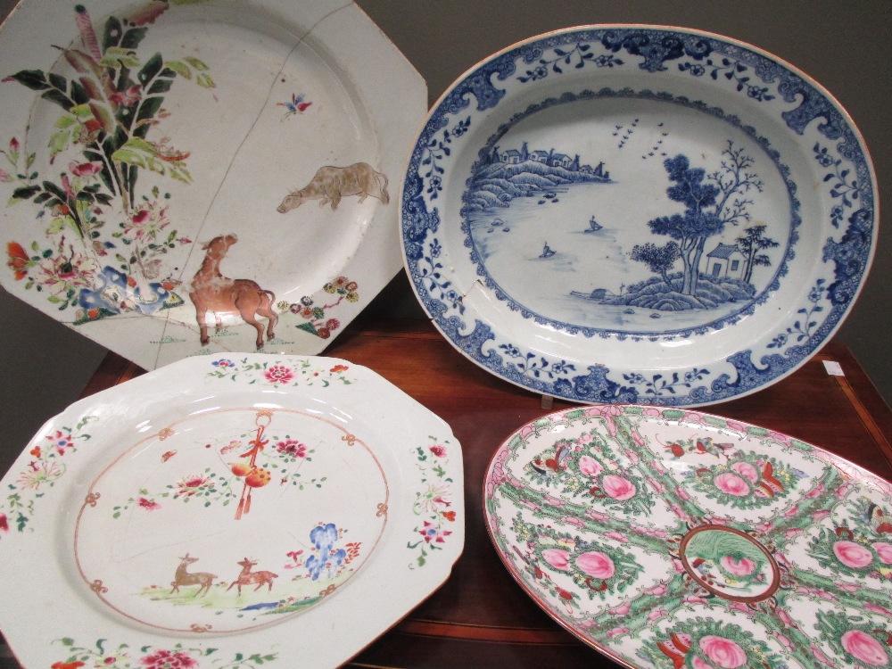 Two 18th century famille rose dishes, 37cm wide, a Canton ovale dish and another blue and white,