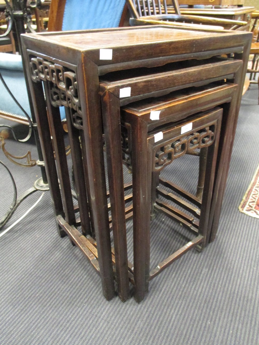 A nest of four Chinese hardwood wine tables