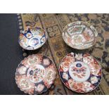 A pair of Imari palette dishes, together with an Imari bowl and a Canton bowl