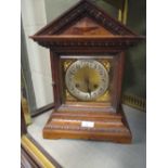 An early 20th century mahogany mantel clock striking on a coiled rod