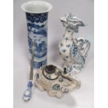 A Chinese elephant incense burner, a tobacco pipe, a blue and white phoenix ewer and a blue and