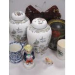 A Huntley & Palmer 'Toby jug' biscuit tin, together with a pair of Wedgwood vases and covers, a