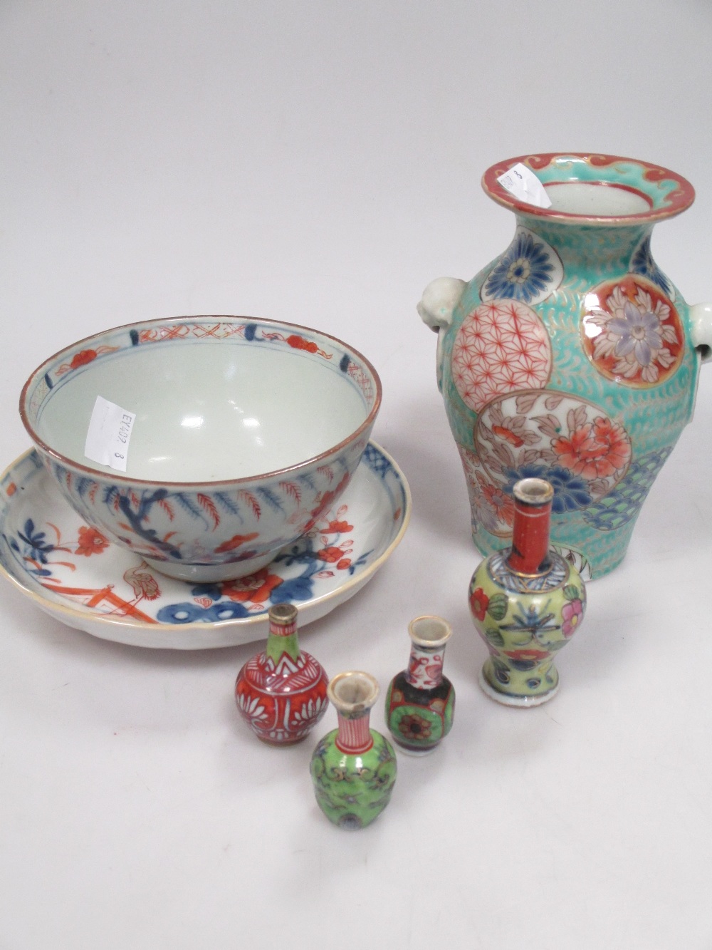 Four miniature Chinese vases, an Imari bowl and saucer and another Chinese vase