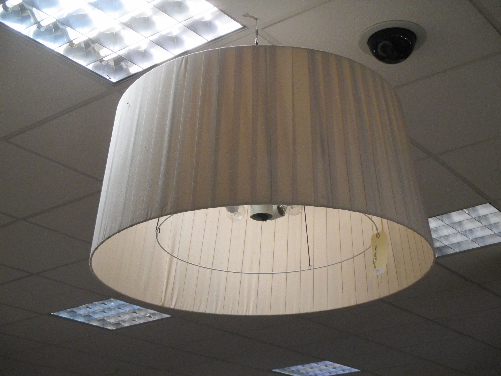 A large pleated fabric ceiling light