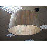 A large pleated fabric ceiling light