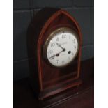 A late 19th century mahogany lancet shaped cased mantel clock, striking on a bell, the circular