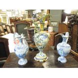 A pair of Hubaudiere blue and white faience ewers together with a coloured Italian maiolica ewer One