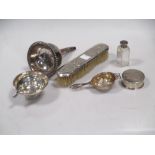 A silver and an Old Sheffield Plate wine strainer, a tea strainer, silver backed clothes brush etc