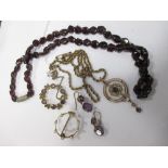 An early 20th century amethyst and seed pearl pendant, on later rope twist chain, an amethyst and