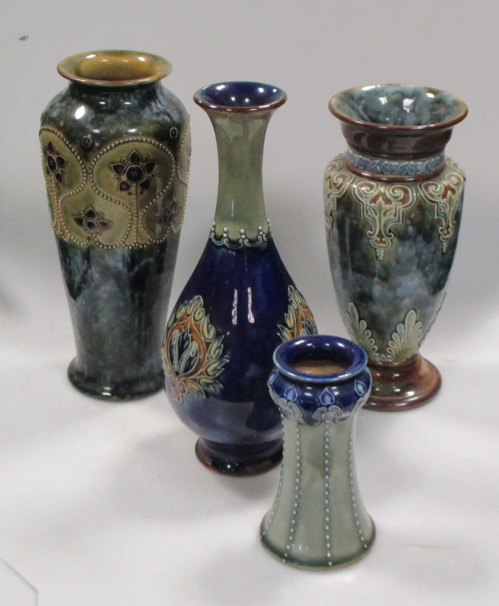 A collection of four Royal Doulton vases