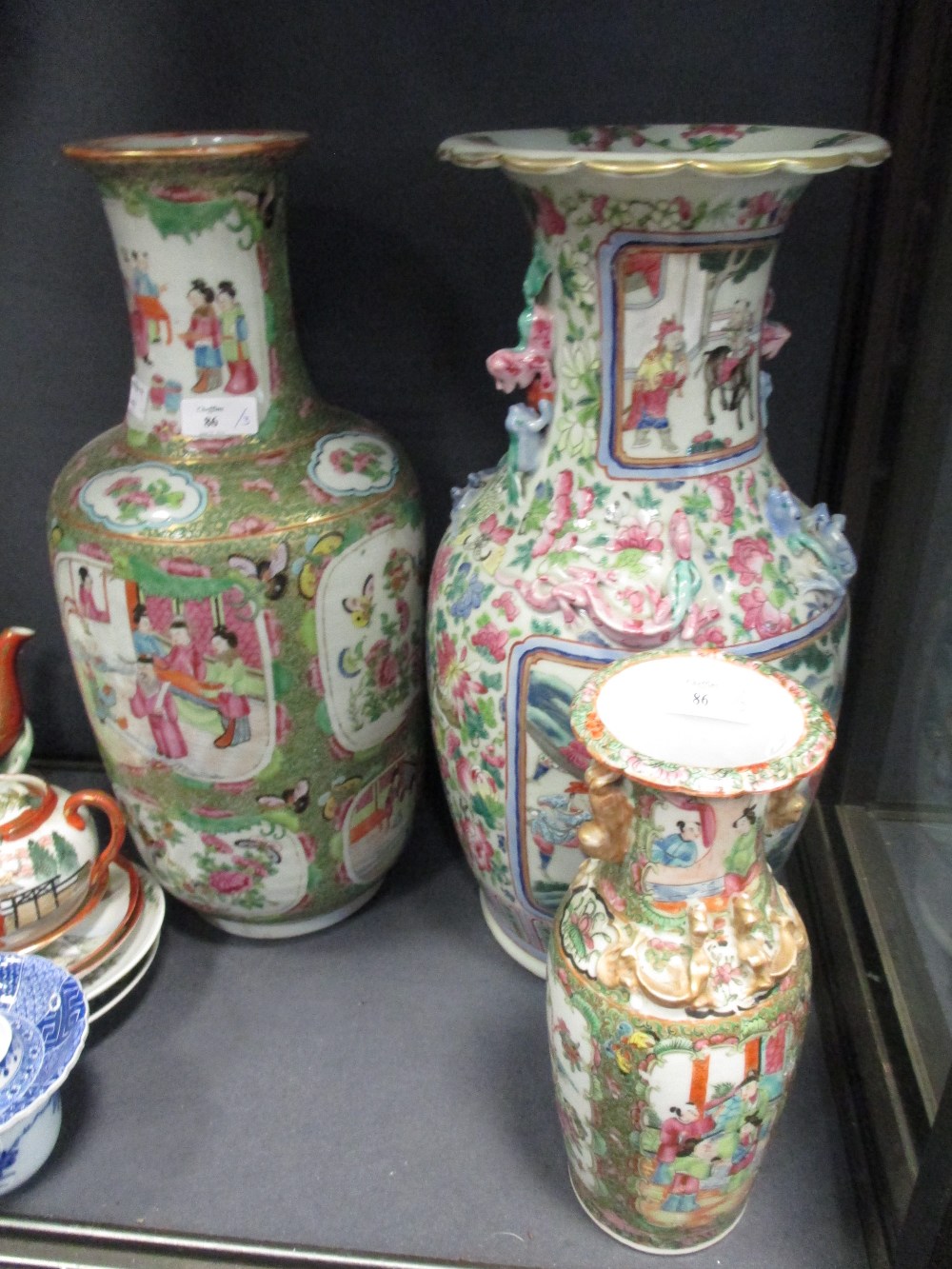 A Canton vase, together with another similar, and another Chinese vase Large Canton vase has no