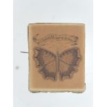 An 18th century pen and ink drawing of a butterfly, the outstretched wings bordered with 'The