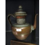 A Tibetan white metal mounted copper tea pot