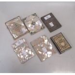 A 19th century mother of pearl card case, together with three others similar (some damage), an