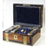 A Victorian walnut and coramandel brass bound travelling box, opening to reveal a selection of Old