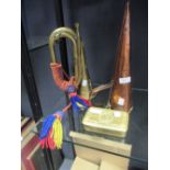 A WWI bugle and a copper ale mulle and chocolate tin