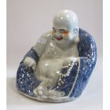 A Chinese figure of Budai, 23cm high