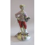 A late 18th century Derby figure of a gallant in a waistcoat and on a floral encrusted base, 19cm