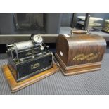 An Edison 'Gem' phonograph, aluminium horn and cylinders