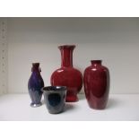 Three red flambe vases and a Yixing type small planter,