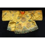 A child's honey ground robe, probably 19th century,