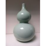 A celadon double gourd vase,