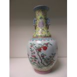 A famille rose bottle vase, six character mark of Guangxu,