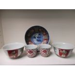 A pair of 18th/19th century tea bowls, a pair of Imari bowls and a single later,