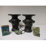 A pair of 19th century bronze vases, a enamel match box sleeve and two greenstone pendants,