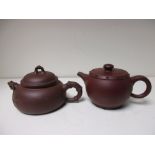 Two Yixing tea pots and covers,