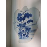 A 19th century blue and white leaf shaped panel