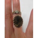 A 9ct smokey quartz dress ring, together with a 9ct illusion set single stone diamond ring (2)