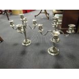 A pair of modern five branch white metal candleabra