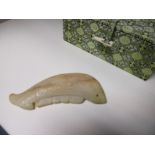 A Chinese russet jade pendant of a fish, 9cm (3.5 in) wide with a brocade box (2)